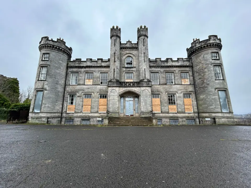 Boarded-up castle frontage at the abandoned Airth Castle and hotel complex.