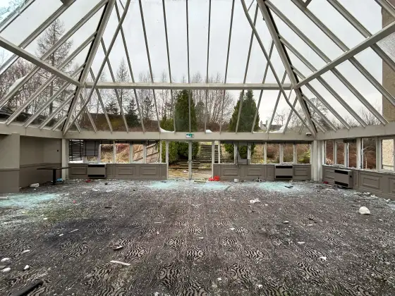Abandoned glass atrium at the abandoned Airth Castle and hotel complex.