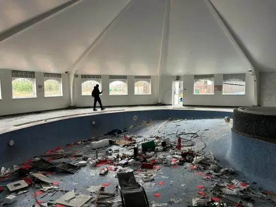 Drained swimming pool filled with debris at the abandoned Airth Castle and hotel complex.