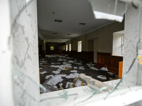 Hotel interior through a broken window at the abandoned Airth Castle and hotel complex.